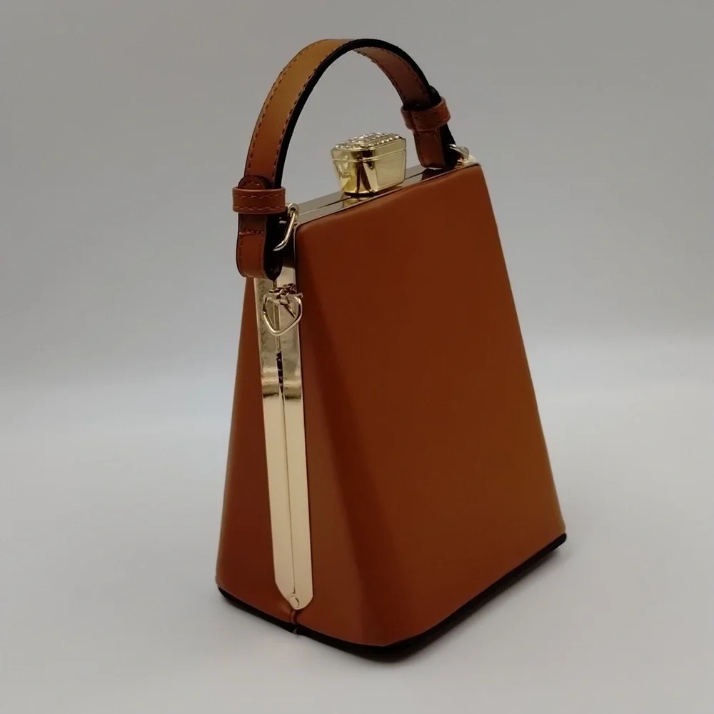 Sophisticated Brown Baby Bag with Gold Accents